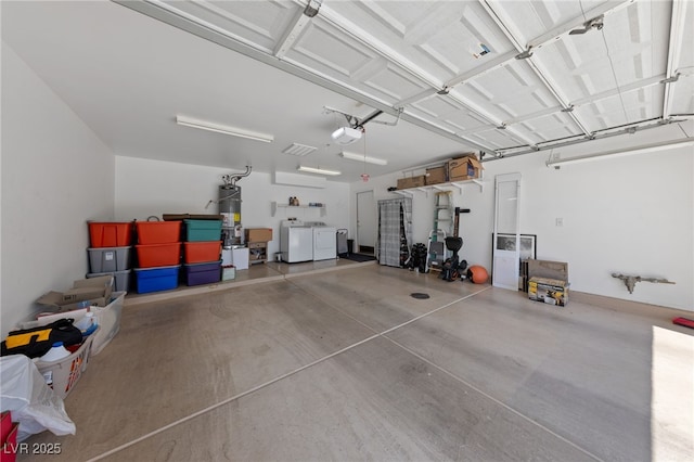 9393 New Utrecht St, Las Vegas, NV 89178 - garage featuring washing machine and clothes dryer, strapped water heater, and a garage door opener