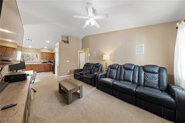 9393 New Utrecht St, Las Vegas, NV 89178 - living area featuring light carpet, a ceiling fan, lofted ceiling, and baseboards