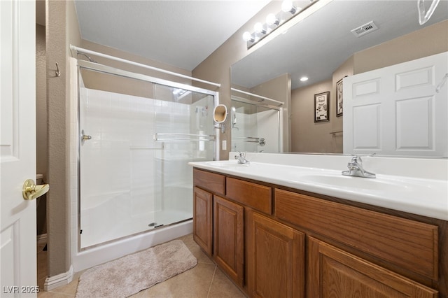 9393 New Utrecht St, Las Vegas, NV 89178 - full bathroom with a stall shower, tile patterned floors, and double vanity