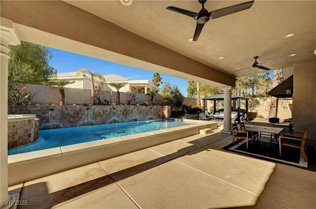 2111 Bogart Ct, Las Vegas, NV 89117 - fenced backyard with a gazebo, a ceiling fan, and a patio area