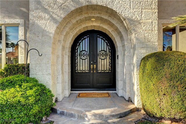 2111 Bogart Ct, Las Vegas, NV 89117 - doorway to property featuring french doors and stone siding