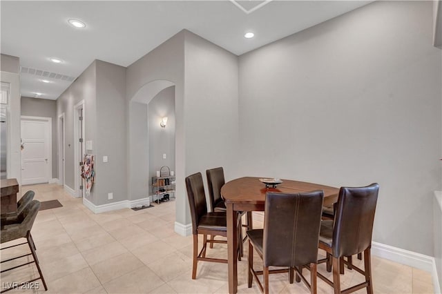 2111 Bogart Ct, Las Vegas, NV 89117 - dining area featuring arched walkways, baseboards, recessed lighting, and light tile patterned floors