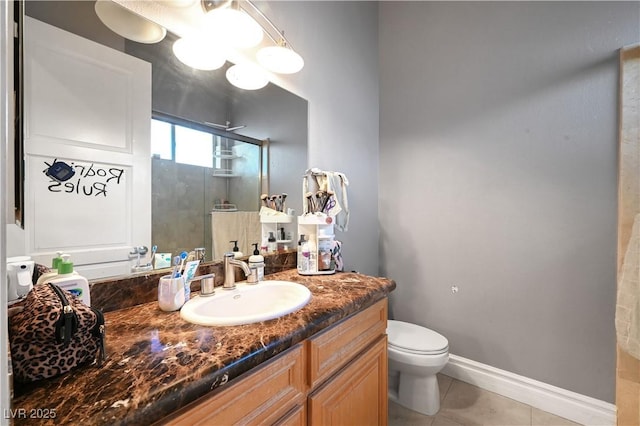 2111 Bogart Ct, Las Vegas, NV 89117 - full bath featuring toilet, a shower stall, vanity, tile patterned flooring, and baseboards