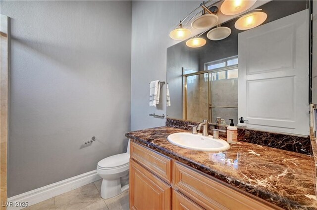 2111 Bogart Ct, Las Vegas, NV 89117 - full bathroom featuring vanity, toilet, a stall shower, and baseboards