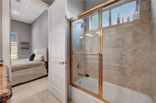 2111 Bogart Ct, Las Vegas, NV 89117 - ensuite bathroom featuring bath / shower combo with glass door and tile patterned floors