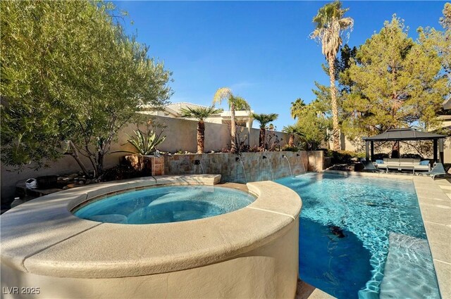 2111 Bogart Ct, Las Vegas, NV 89117 - view of pool with an in-ground hot tub, a gazebo, a fenced backyard, and outdoor lounge area