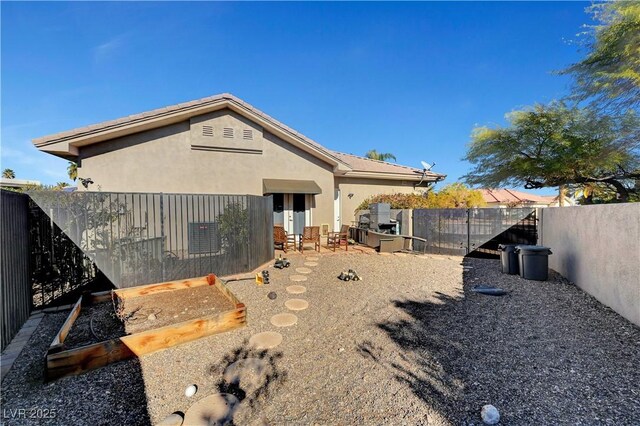 2111 Bogart Ct, Las Vegas, NV 89117 - rear view of house with a fenced backyard and stucco siding