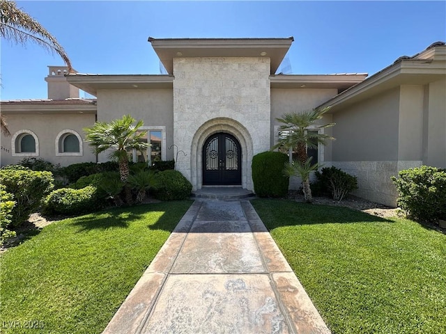 2111 Bogart Ct, Las Vegas, NV 89117 - view of front of house featuring french doors, a front yard, and stucco siding