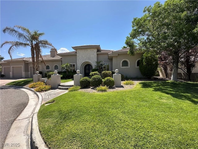 2111 Bogart Ct, Las Vegas, NV 89117 - mediterranean / spanish house with stucco siding, a front lawn, and a garage