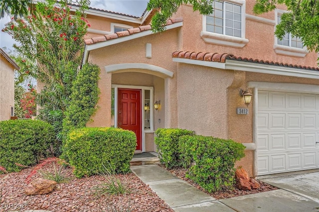 3412 Crystal Tower St, Las Vegas, NV 89129 - view of exterior entry with stucco siding and a tile roof