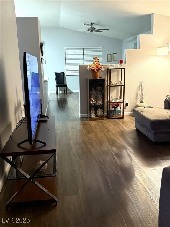 1367 Sun Pillars Ave, Henderson, NV 89014 - living room with dark wood-style floors, ceiling fan, and vaulted ceiling