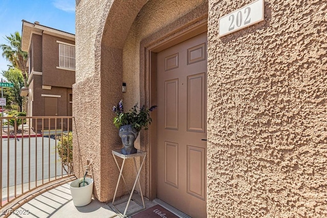 10180 Delray Beach Ave Unit 202, Las Vegas, NV 89129 - doorway to property featuring stucco siding