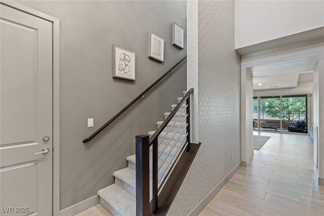 4290 Solace St, Las Vegas, NV 89135 - stairs with baseboards and wood finished floors