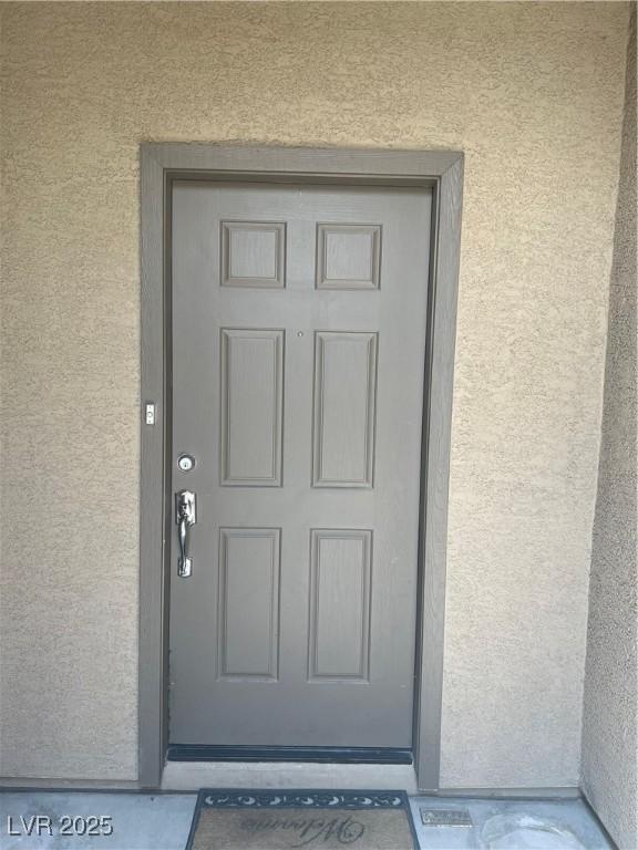 6092 Fox Creek Ave, Las Vegas, NV 89122 - entrance to property featuring stucco siding