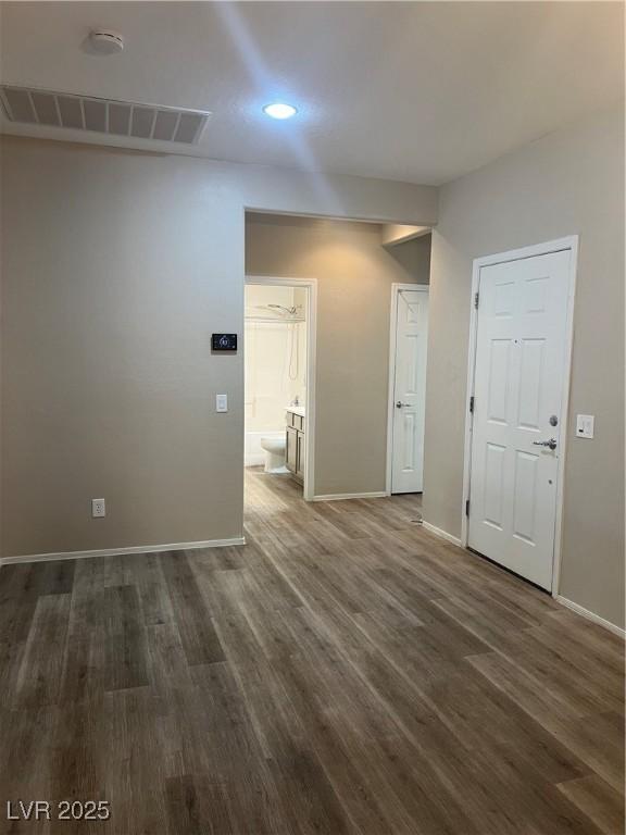 6092 Fox Creek Ave, Las Vegas, NV 89122 - unfurnished room with baseboards, dark wood-type flooring, recessed lighting, and a smoke detector