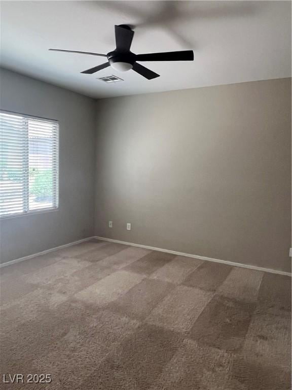 6092 Fox Creek Ave, Las Vegas, NV 89122 - empty room with carpet flooring, a ceiling fan, and baseboards