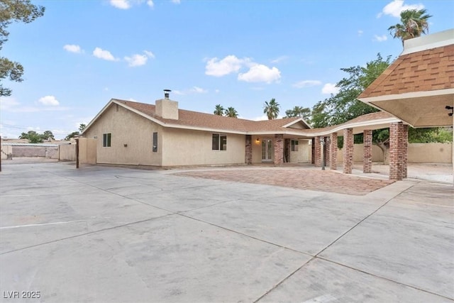 4805 Jay Ave, Las Vegas, NV 89130 - back of house featuring a chimney