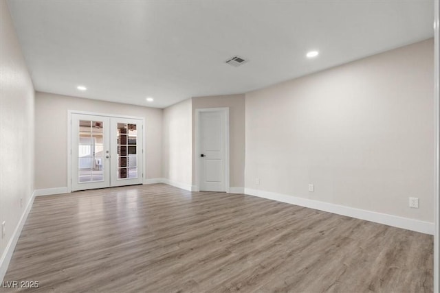 4805 Jay Ave, Las Vegas, NV 89130 - spare room with wood finished floors, french doors, baseboards, and recessed lighting