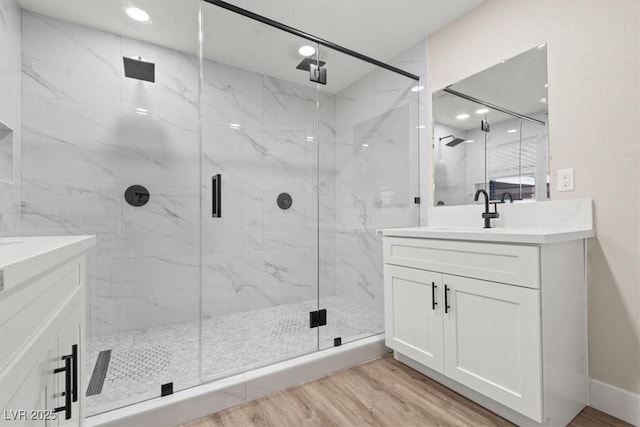 4805 Jay Ave, Las Vegas, NV 89130 - bathroom featuring vanity, a marble finish shower, wood finished floors, and recessed lighting