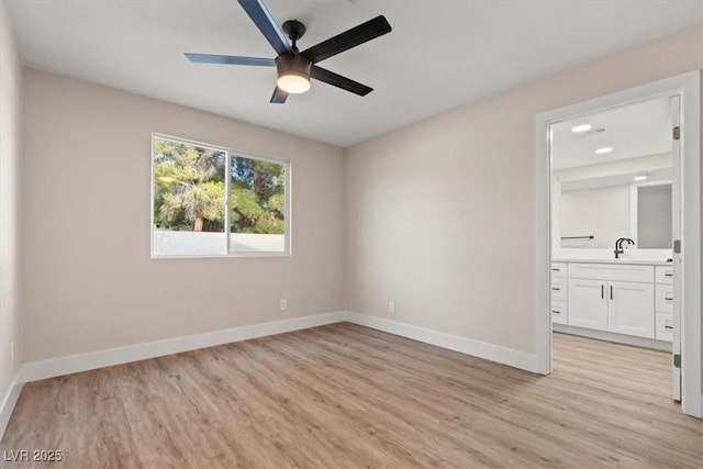 4805 Jay Ave, Las Vegas, NV 89130 - unfurnished room featuring a ceiling fan, light wood-type flooring, and baseboards