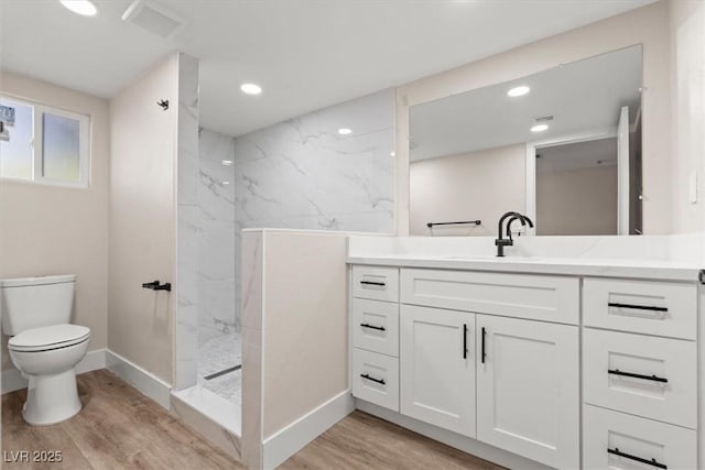 4805 Jay Ave, Las Vegas, NV 89130 - full bath with wood finished floors, vanity, baseboards, toilet, and a marble finish shower