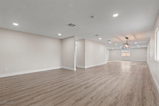 4805 Jay Ave, Las Vegas, NV 89130 - unfurnished living room with light wood-style floors, recessed lighting, and baseboards