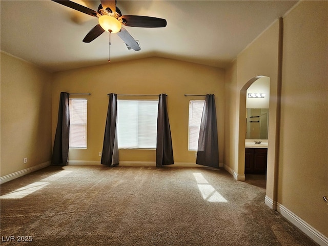 9462 Alhambra Valley St, Las Vegas, NV 89178 - carpeted empty room featuring arched walkways, vaulted ceiling, ceiling fan, and baseboards