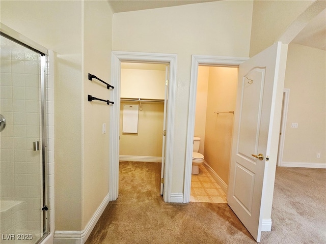 9462 Alhambra Valley St, Las Vegas, NV 89178 - full bath featuring a stall shower, toilet, a walk in closet, and baseboards