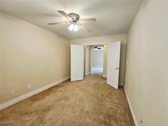 9462 Alhambra Valley St, Las Vegas, NV 89178 - unfurnished bedroom with light carpet, baseboards, and a ceiling fan
