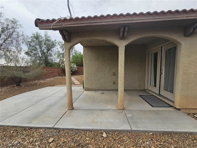 9462 Alhambra Valley St, Las Vegas, NV 89178 - fenced backyard featuring french doors and a patio area