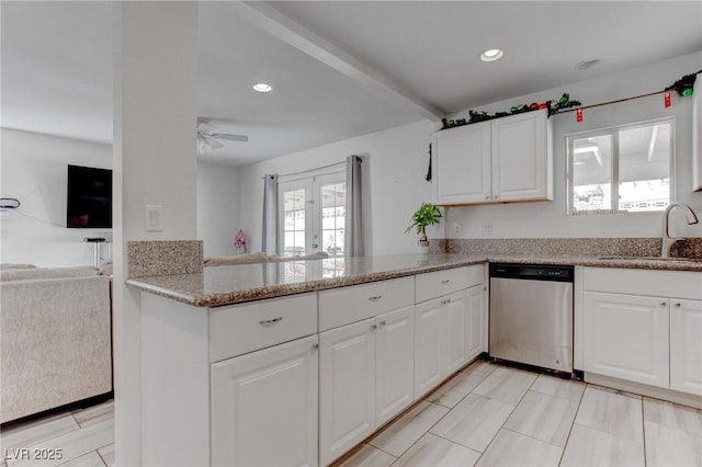 4739 Glenndavis Dr, Las Vegas, NV 89121 - kitchen featuring dishwasher, a sink, ceiling fan, white cabinetry, and open floor plan