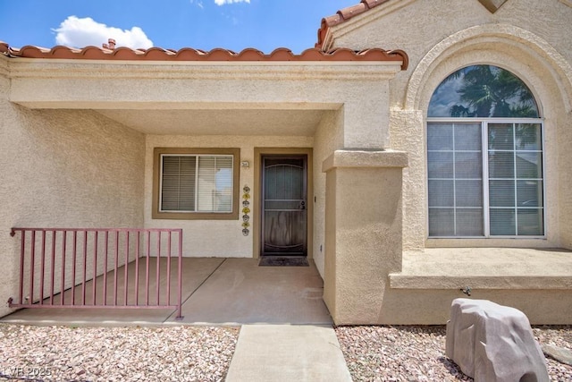 610 Playa Del Sol Way, Henderson, NV 89015 - view of exterior entry with stucco siding and a tile roof