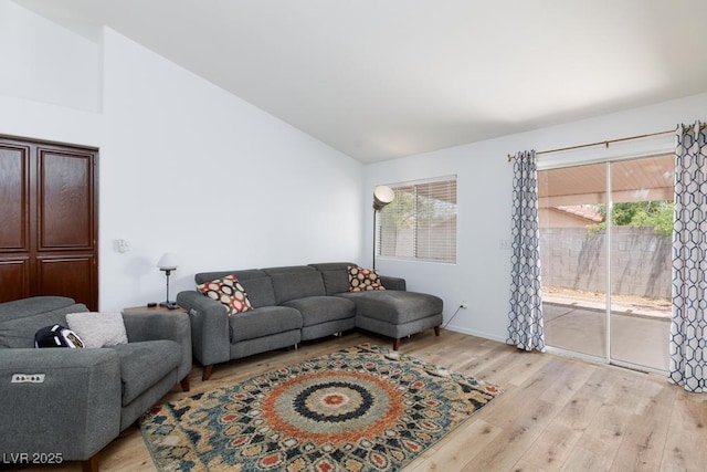 610 Playa Del Sol Way, Henderson, NV 89015 - living area featuring vaulted ceiling, light wood-style flooring, healthy amount of natural light, and baseboards