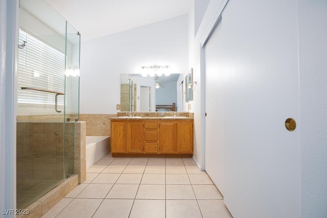 610 Playa Del Sol Way, Henderson, NV 89015 - bathroom with a shower stall, double vanity, a ceiling fan, a garden tub, and tile patterned floors