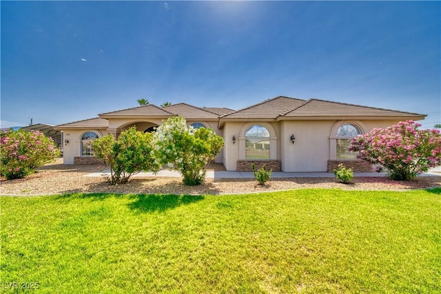 2851 Winchester Ave, Pahrump, NV 89048 - mediterranean / spanish home featuring stucco siding and a front yard