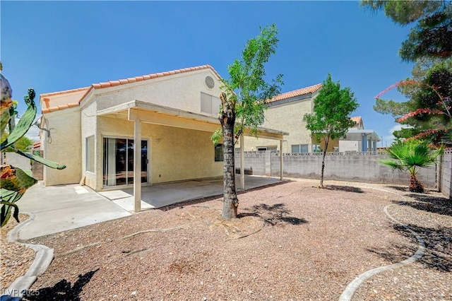 420 Clifton Heights Dr, Las Vegas, NV 89145 - rear view of house featuring a tile roof, stucco siding, and a patio