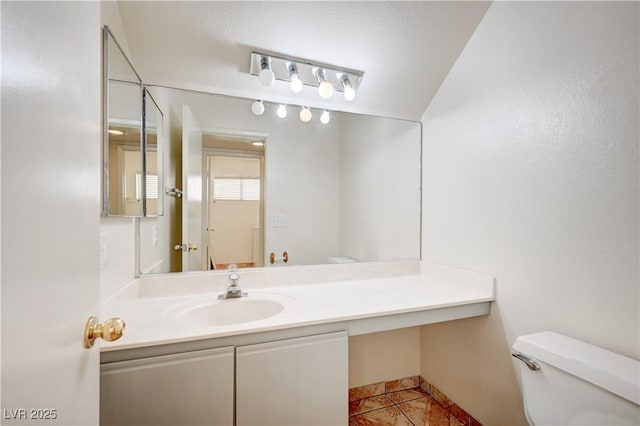 420 Clifton Heights Dr, Las Vegas, NV 89145 - bathroom with toilet, vanity, and tile patterned flooring
