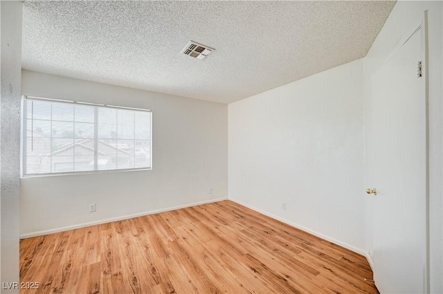 420 Clifton Heights Dr, Las Vegas, NV 89145 - unfurnished room with wood finished floors, a textured ceiling, and baseboards