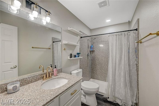 2451 N Rainbow Blvd Unit 2076, Las Vegas, NV 89108 - bathroom with vanity, toilet, shower / tub combo, and wood finished floors