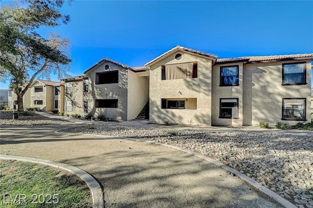 2451 N Rainbow Blvd Unit 2076, Las Vegas, NV 89108 - multi unit property with stucco siding, a tiled roof, and stairway