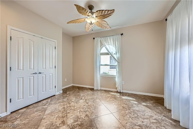 2148 Shadow Canyon Dr, Henderson, NV 89044 - unfurnished bedroom featuring a closet, baseboards, and a ceiling fan