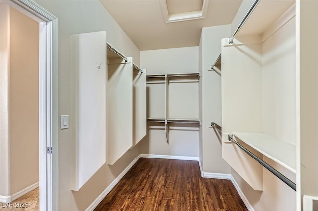2148 Shadow Canyon Dr, Henderson, NV 89044 - walk in closet featuring dark wood finished floors and attic access