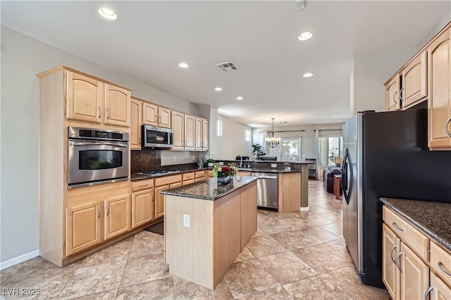 2148 Shadow Canyon Dr, Henderson, NV 89044 - kitchen featuring stainless steel appliances, light brown cabinets, a peninsula, a kitchen island, and recessed lighting
