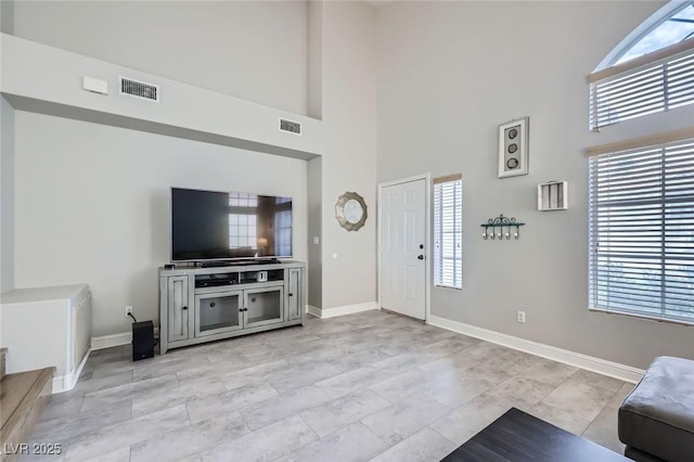 2418 Antler Point Dr, Henderson, NV 89074 - living area featuring a towering ceiling and baseboards