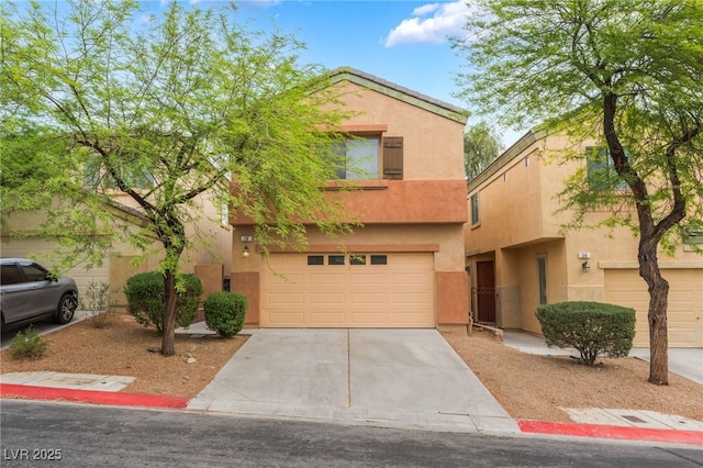 28 Yellow Flame Ave, North Las Vegas, NV 89084 - view of property with a garage, concrete driveway, and stucco siding