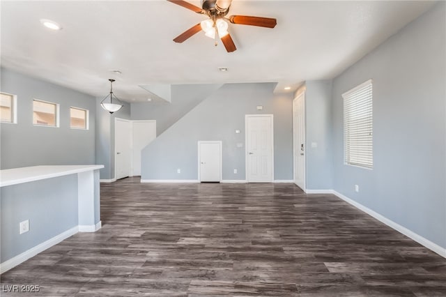 28 Yellow Flame Ave, North Las Vegas, NV 89084 - unfurnished living room featuring baseboards, recessed lighting, dark wood-style floors, and a ceiling fan