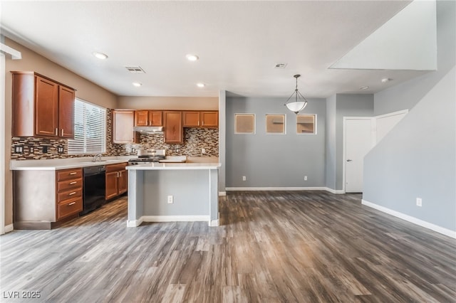28 Yellow Flame Ave, North Las Vegas, NV 89084 - kitchen featuring dishwasher, stainless steel stove, light countertops, wood finished floors, and decorative backsplash