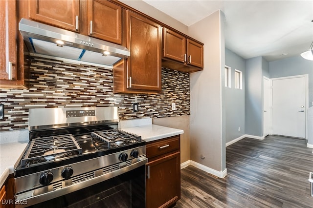 28 Yellow Flame Ave, North Las Vegas, NV 89084 - kitchen featuring gas stove, range hood, light countertops, dark wood-style floors, and backsplash