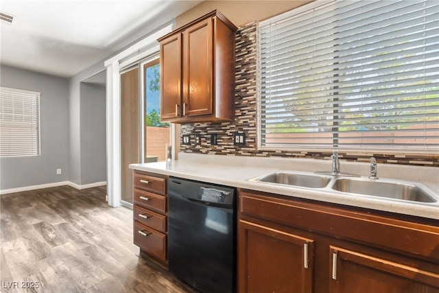 28 Yellow Flame Ave, North Las Vegas, NV 89084 - kitchen with black dishwasher, a sink, light countertops, and healthy amount of natural light