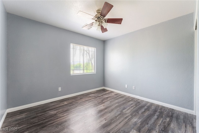 28 Yellow Flame Ave, North Las Vegas, NV 89084 - spare room with dark wood-type flooring, ceiling fan, and baseboards